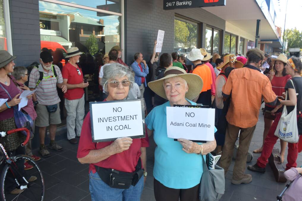 NOT HAPPY: Pat Horan, from Mount Alexander Sustainability Group, and Noreen Boord, a Greens member, take part in the protest outside Westpac's Bendigo branch.