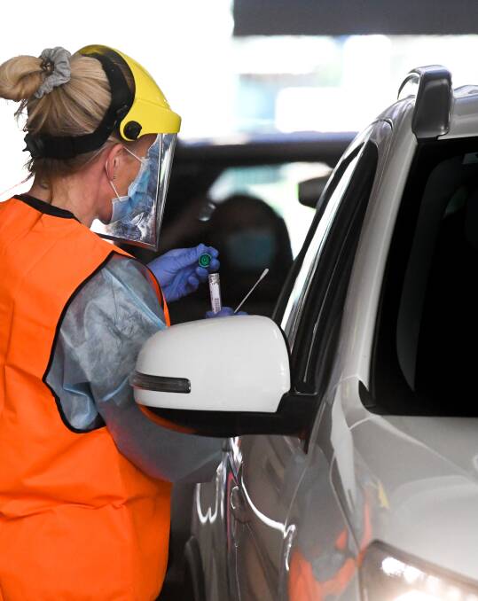 A test is conducted at the Bendigo drive-through testing clinic. Picture: NONI HYETT
