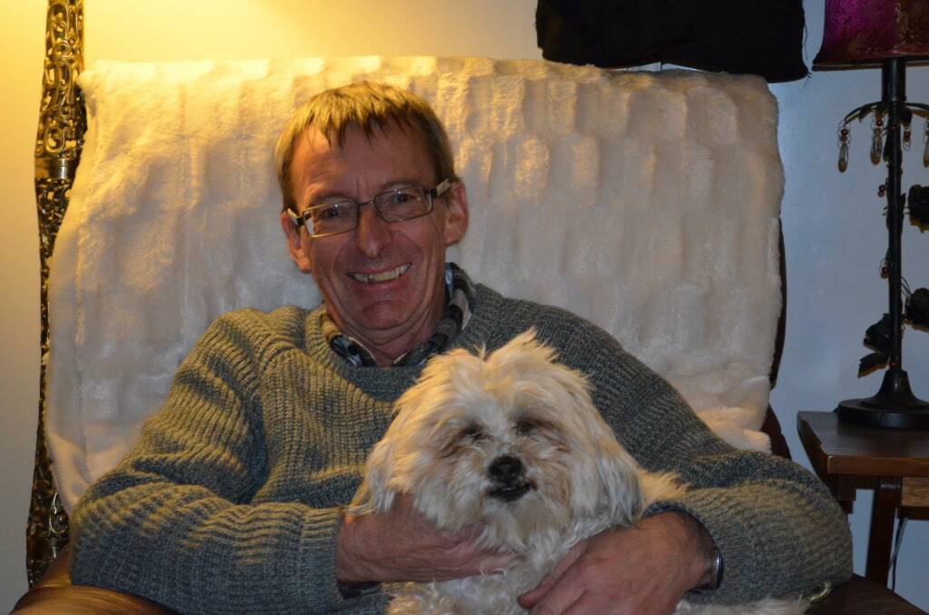 MISSED: Phil Brusch (pictured with his dog Freddie) is remembered by his loved ones and colleagues as a dedicated, caring person.