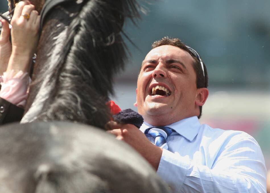 JAILED: Mark Dosen, who's been convicted of several serious offences including kidnapping, celebrating at the 2007 Melbourne Cup, which Efficient - a horse he helped train - won. Picture: SEBASTIAN COSTANZO