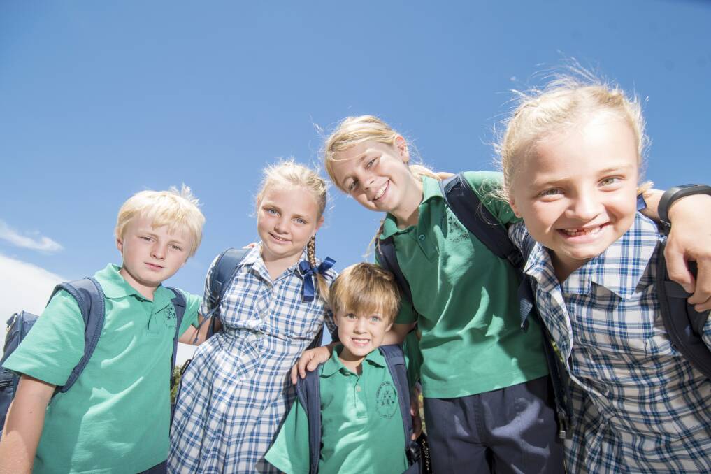 FAMILY: Four-year-old Raff, centre, is starting prep at St Francis of the Fields Primary School, following in the footsteps of older siblings Flynn, Georgia, Archie and Isabella.