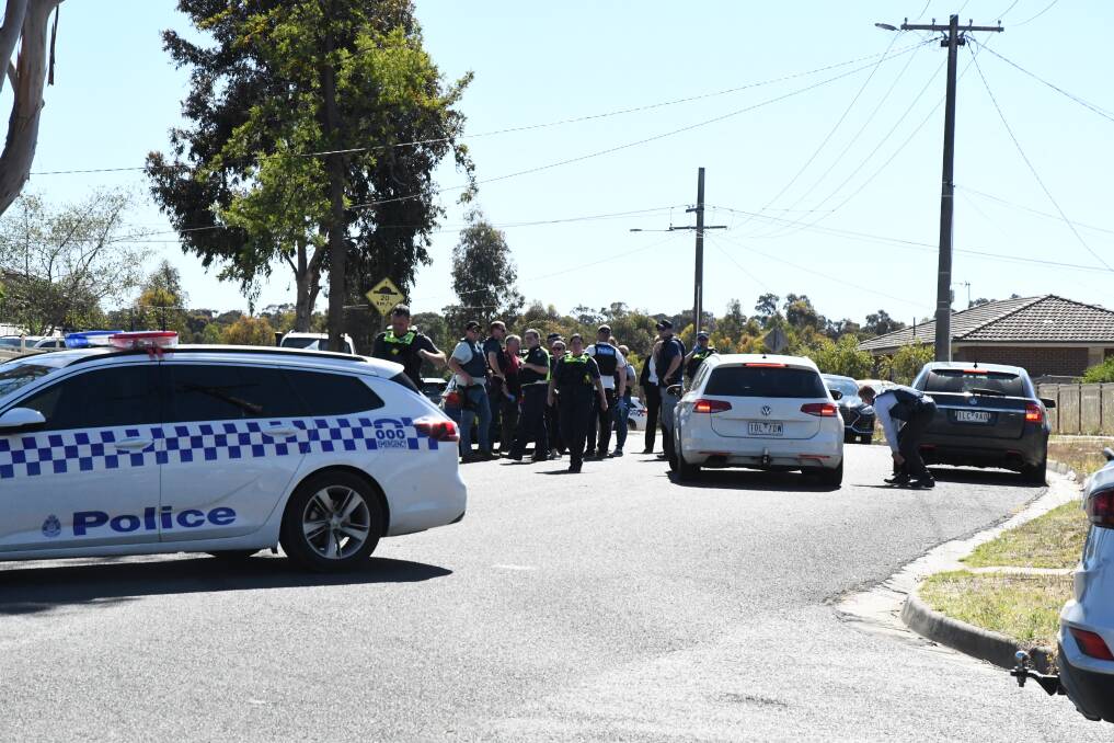 Police in Long Gully last December, during a search for Zane East. Picture: CHRIS PEDLER