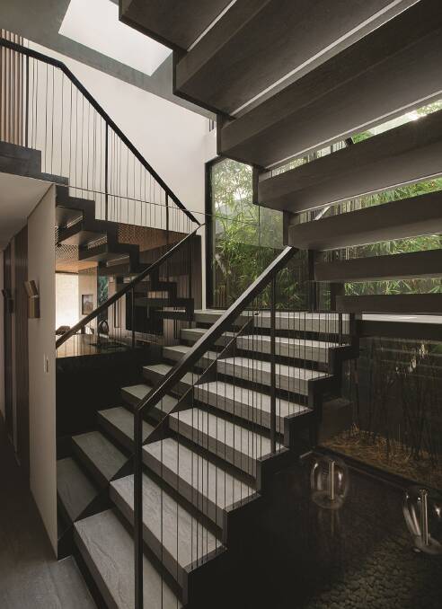 ASCENDING: The property is defined by its central, full-glass lightwell and three-level staircase.
