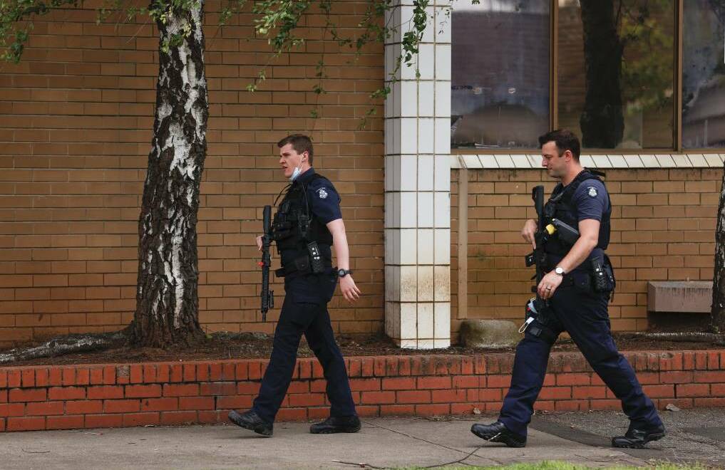 Police were heavily armed as they searched the university after the alleged threat.