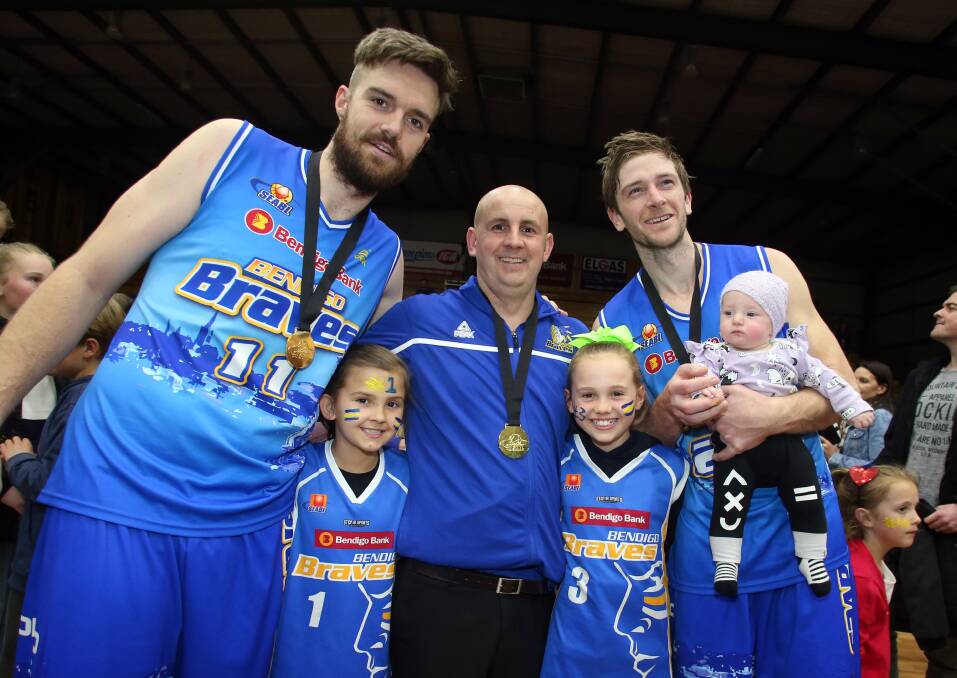 Taylor Bell, with coach Ben Harvey and long-time team-mate Chris Hogan are pictured after the Bendigo Braves' 2016 conference grand final win. Bell will play his 350th SEABL game against Mount Gambier Pioneers on Friday night.