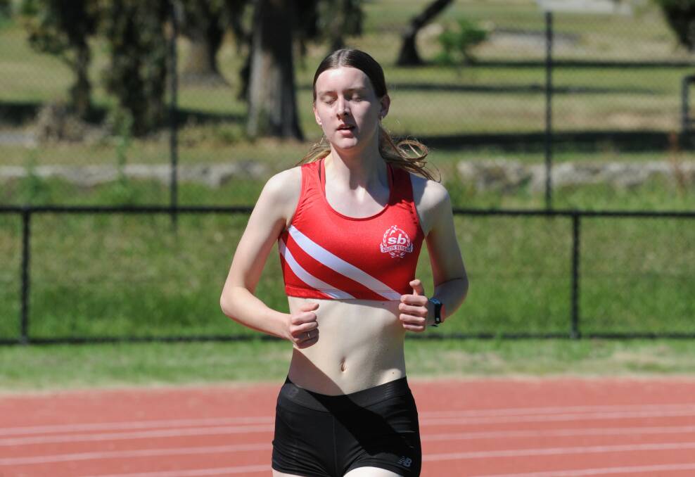 Taryn Furletti set a new open and under-20 record in the 3000m steeplechase on Saturday night. Picture: ADAM BOURKE