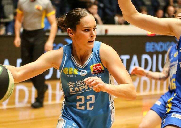 Kelly Wilson looks to drive to the basket during the University of Canberra Capitals' double overtime win against Bendigo Spirit. Picture: CRAIG DILKS PHOTOGRAPHY