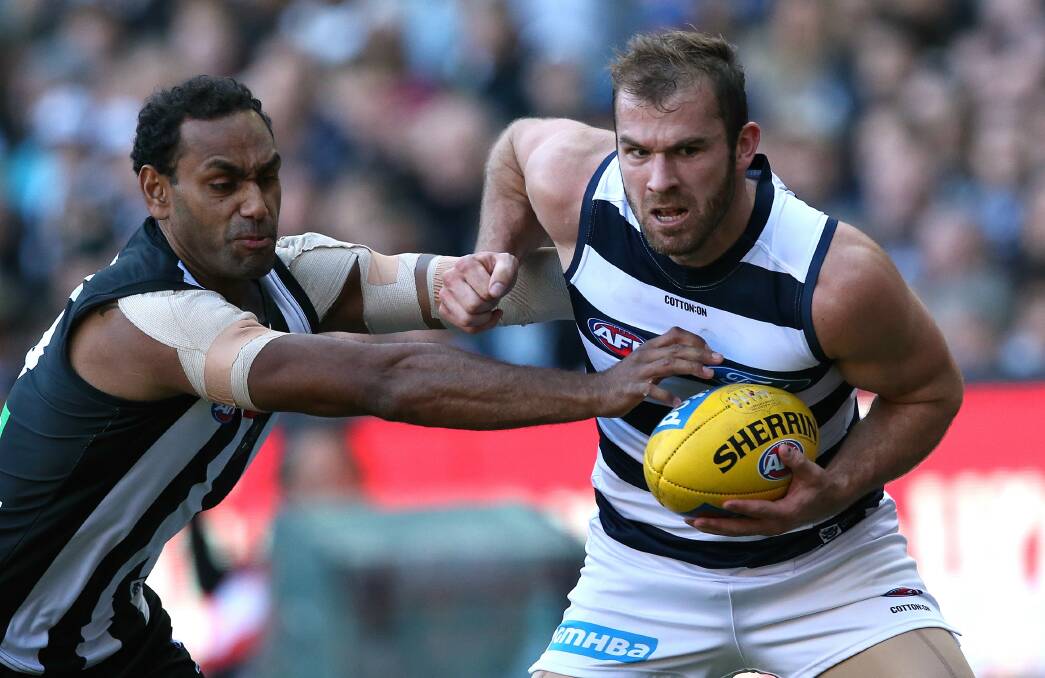 Stewart Crameri is tackled by Travis Varcoe during Geelong's round 8 clash against Collingwood at the MCG this season.  Picture: WAYNE LUDBEY