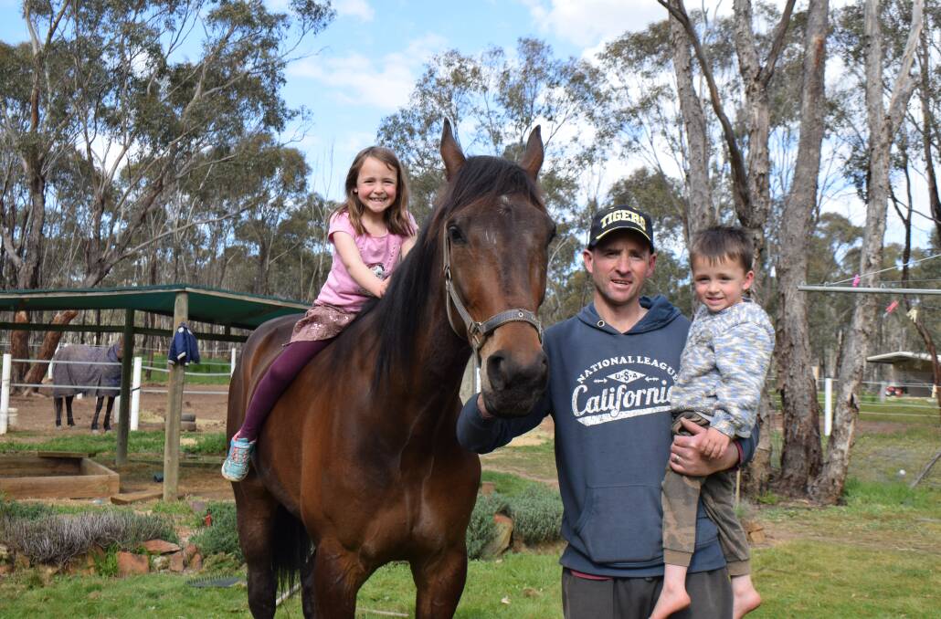 Eppalock trainer Anthony Crossland with daughter Olivia, 6, and son Levi, 3, and Rules Dont Apply. Picture: KIERAN ILES