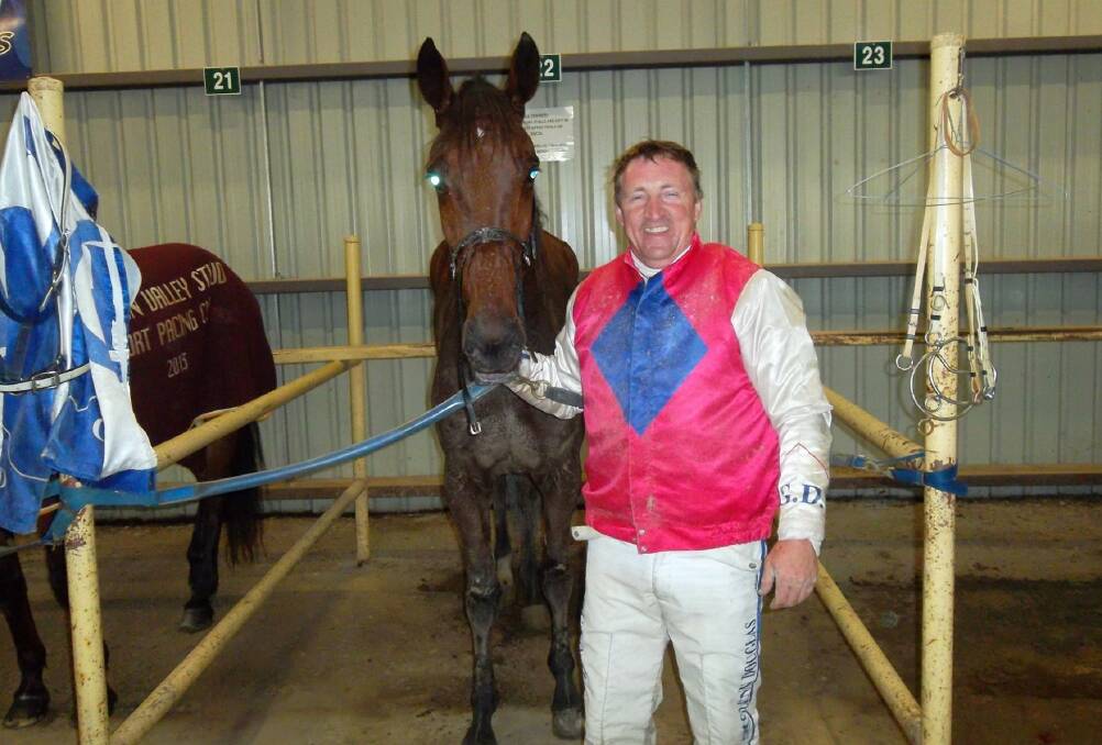 Glenn Douglas with the third of his three winners Keayang Sandy. Picture: SHEPPARTON HARNESS RACING CLUB