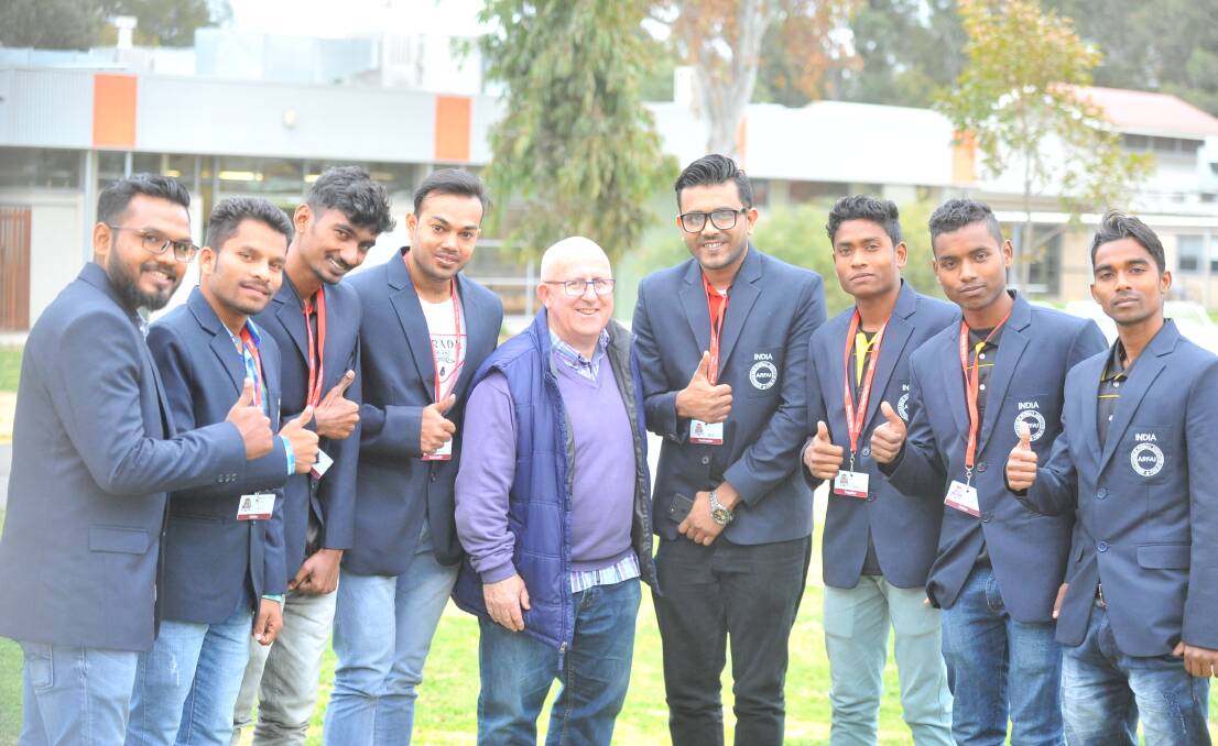 Members of the Indian team with Pastor Bruce Claridge. Picture: KIERAN ILES