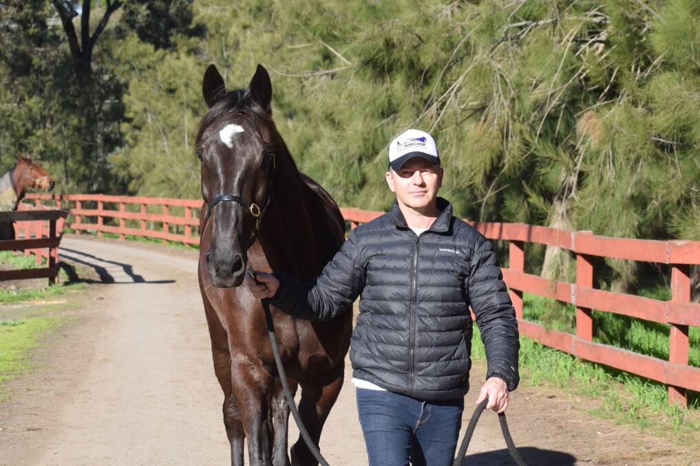 Rod Lakey with his four-year-old pacing gelding Jong Ang on Gary Donaldson's Junortoun property. Picture: KIERAN ILES