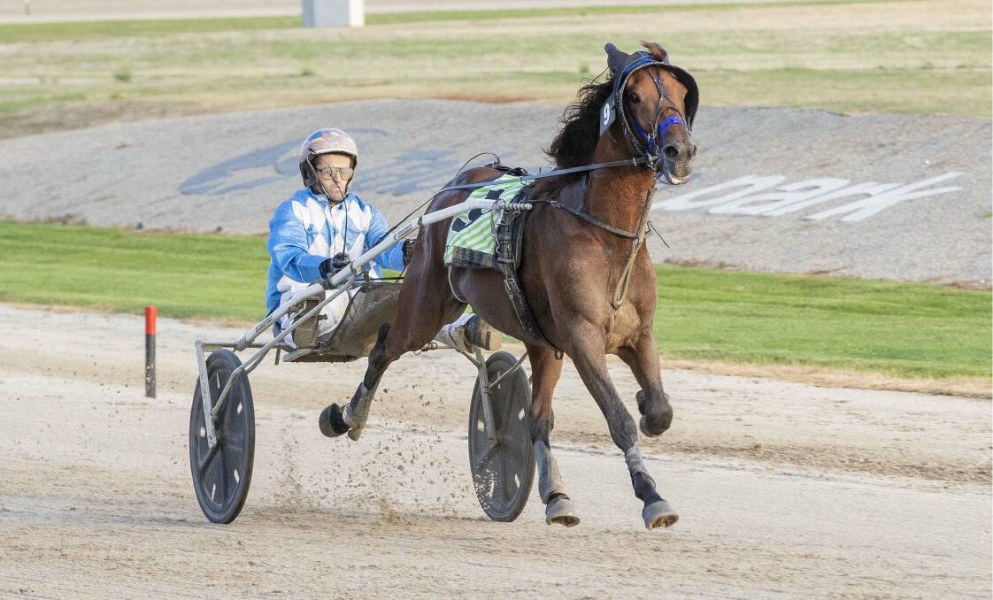 Sundons Courage, driven by Ryan Duffy, sprints to an emphatic win in the Niota Bloodstock Trot (NR 70 to 85) at Tabcorp Park Melton on Friday night. Picture: STUART McCORMICK