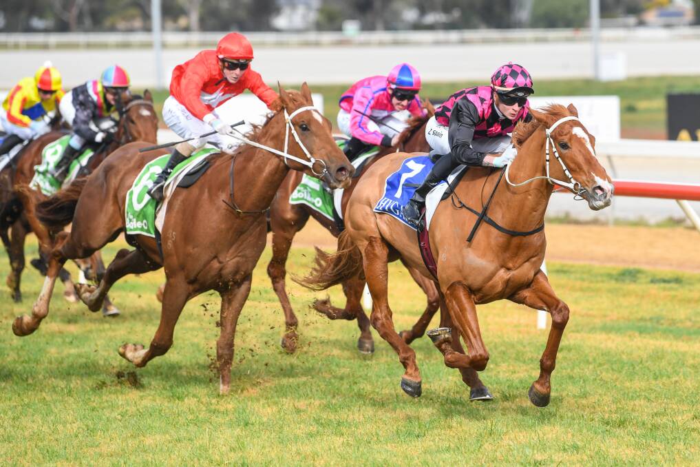 The Kym Hann-trained Big Boy's Girl (Zac Spain) sprints to victory at Swan Hill on Monday. Picture: RACING PHOTOS