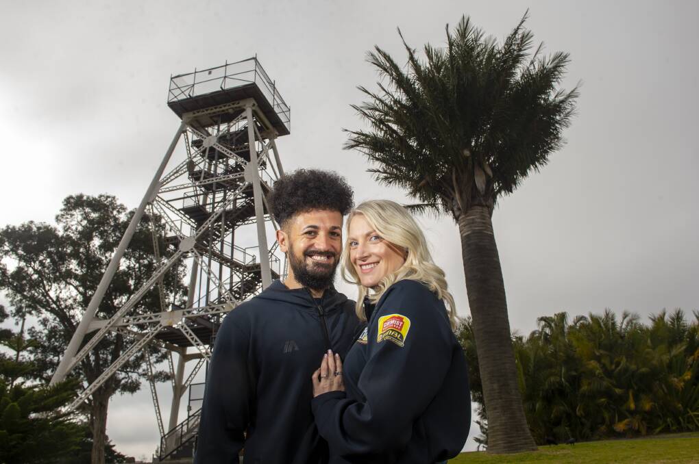 Newly reappointed Bendigo Spirit lead assistant coach Mark Alabakov with fiancee Rebecca Gillies at Bendigo's iconic poppet head. The couple has recently announced their engagement. Picture: DARREN HOWE