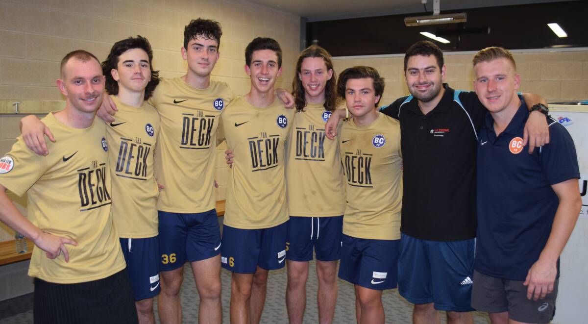 FOND FAREWELL: Will Keating (fourth from left) is embraced by team-mates following his final game for Bendigo City FC against Ballarat last Saturday night. The 18-year-old has signed on for an Australian Defence Force gap year. Picture: KIERAN ILES