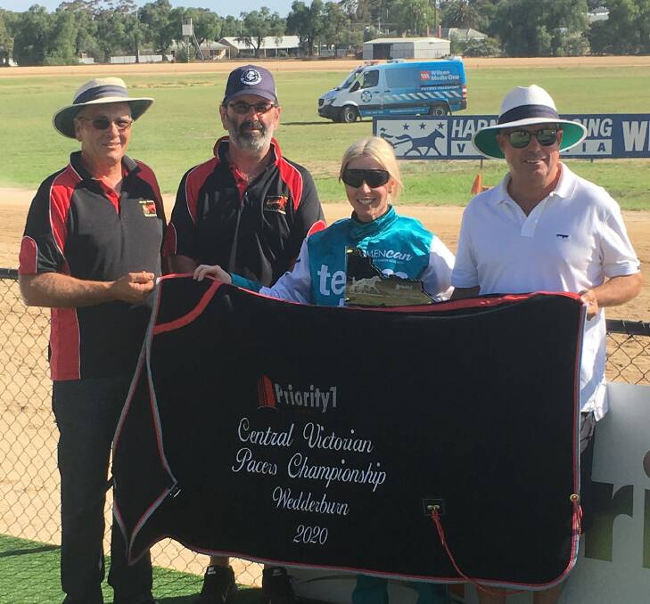 Wedderburn Harness Racing Club president Bruce Hargreaves, secretary Tom Nisbet and Chris Garlick, from race sponsor Priority 1 Property, with Kate Gath following her win aboard Pacifico Dream in the Central Victorian Pacing Championship.