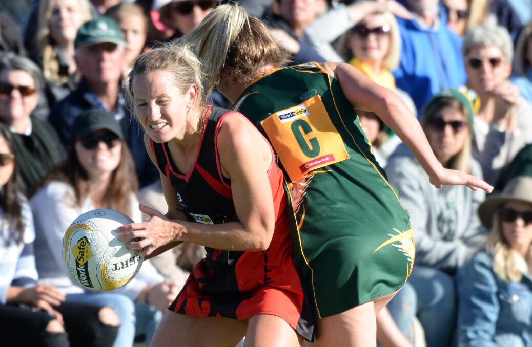 HIGH STAKES: White Hills coach Lauren Bowles and Colbinabbin midcourt ace Olivia McEvoy collide in the heat of battle during last season's HDFNL grand final. The great rivals clash at Huntly again on Saturday. Picture: DARREN HOWE