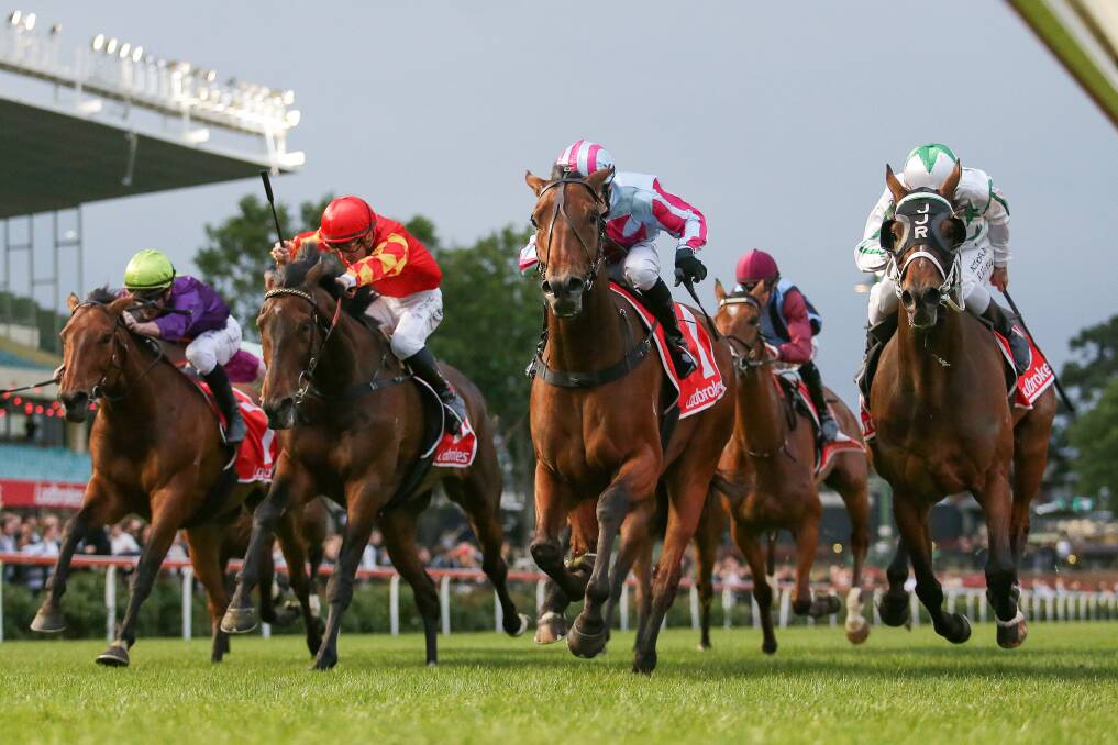 Chains Of Honour, ridden by Josh Richards (in blue and pink), narrowly staves off Wellsford and Rhys McLeod (white and green) to win the benchmark 70 over 2500m at Moonee Valley on Friday night. Picture: RACING PHOTOS