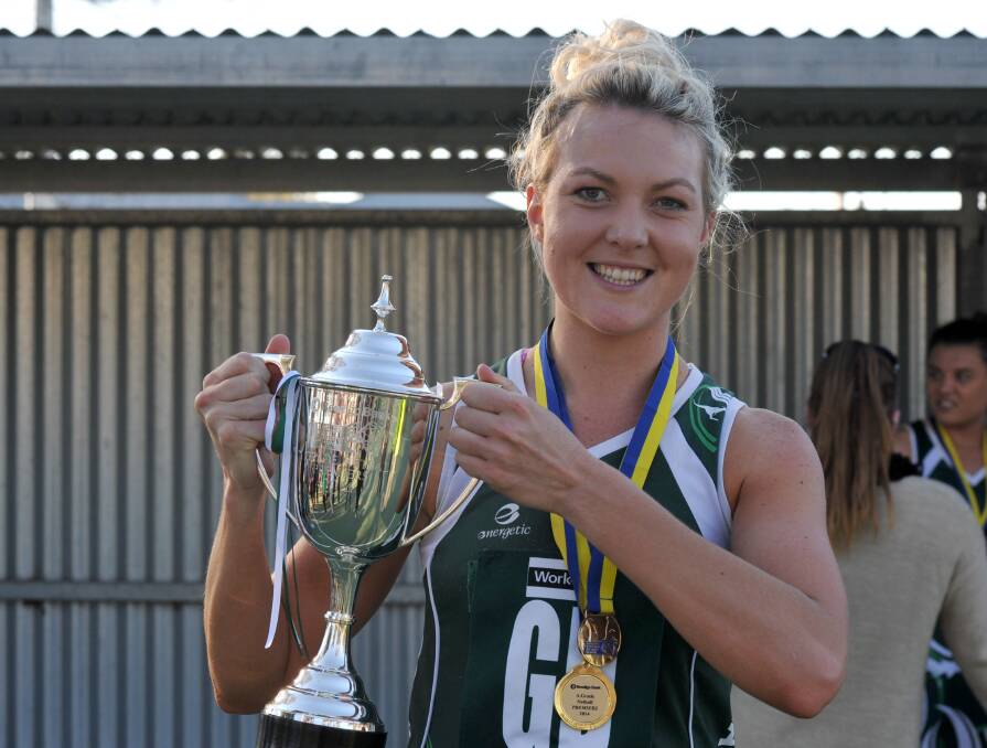 GREAT MEMORIES: McGlashan celebrates a premiership and a grand final best on court medal in 2014 following a 53-35 win over Golden Square. Picture: JODIE DONNELLAN