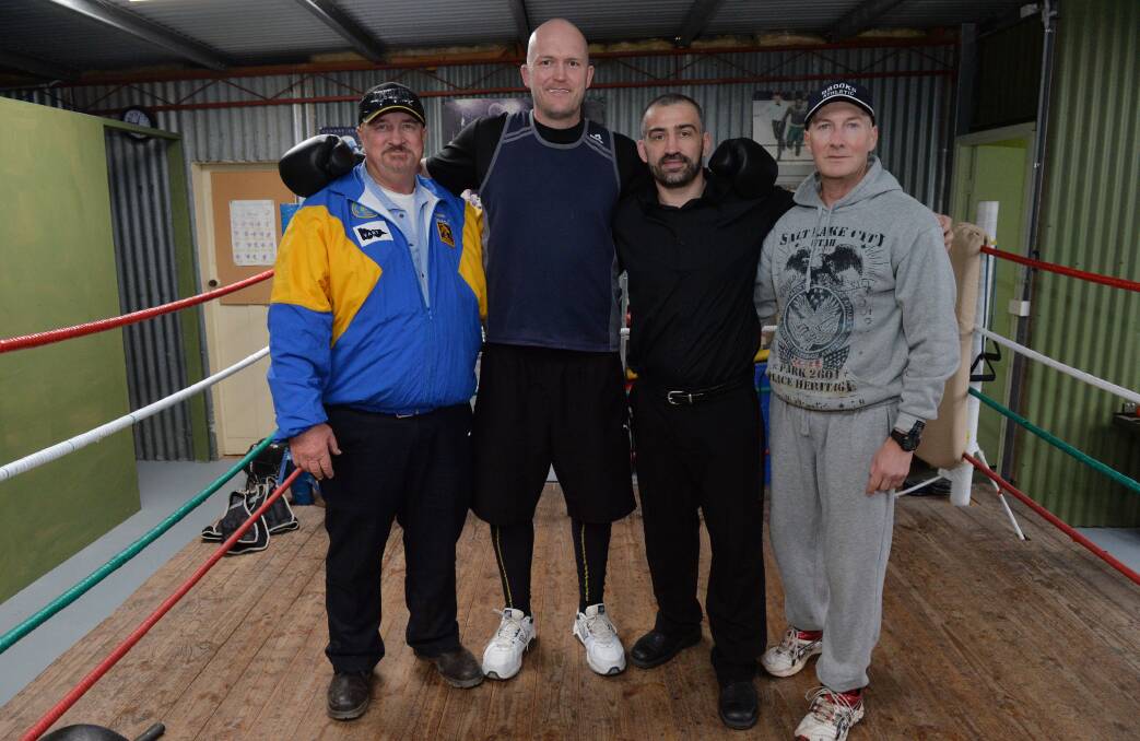 Bendigo's Justin Whitehead with his trainers Pat and Gary Connolly (on the ends) and promoter Lynden Hosking, from Hosking Promotions. Picture: BRENDAN McCARTHY