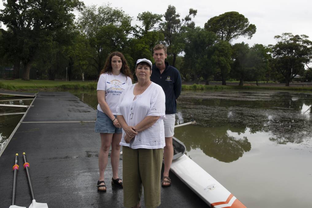 Bendigo Rowing Club's Neve Coleman, Cathleen Farrelly and Lachlan McGrath have been grounded as an irritating pond weed takes hold at Lake Weeroona. Picture: NONI HYETT