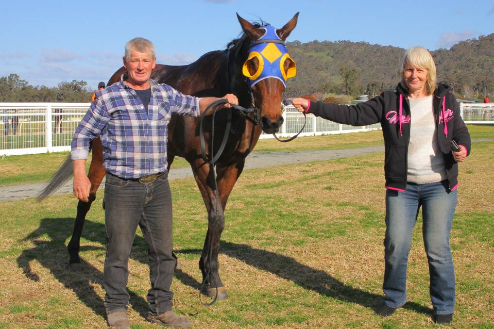 Trainer Daryn Drust and owner and breeder Shelley Thompson with Cooter Cha Cha at Wodoinga. Picture: RACING PHOTOS