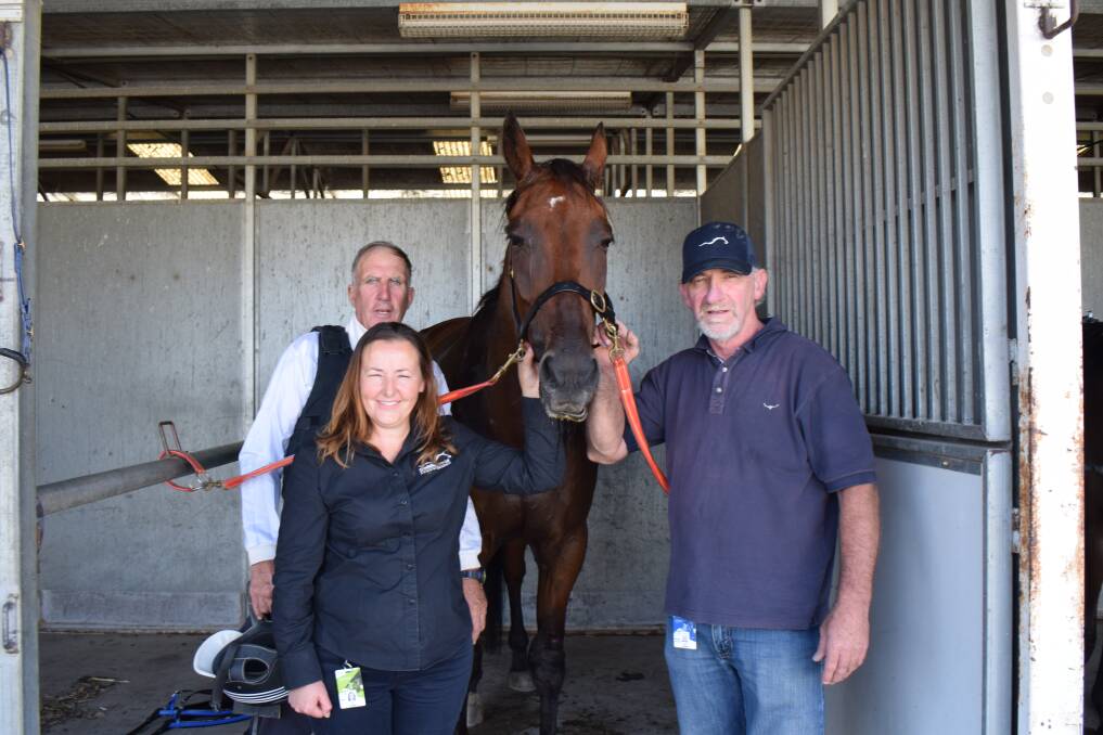 VICTORY: Trainer Col and Ann Latter with reinsman Mark Hayes and I Am Marquez following their win at Lord's Raceway on Thursday night. Picture: KIERAN ILES