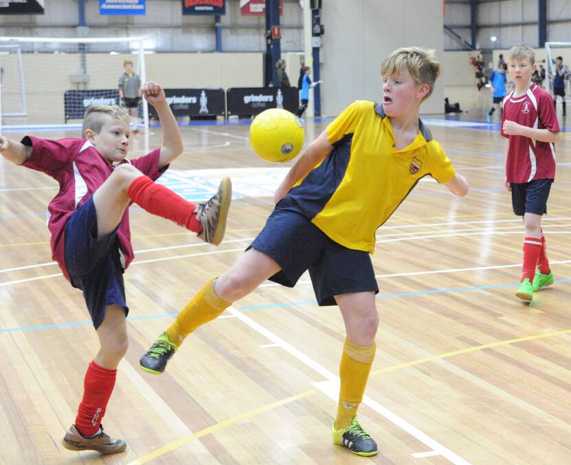 Hamish Walker in action for Girton Grammar at last week's Bendigo School Futsal Titles at Bendigo Stadium. Piicture: NONI HYETT