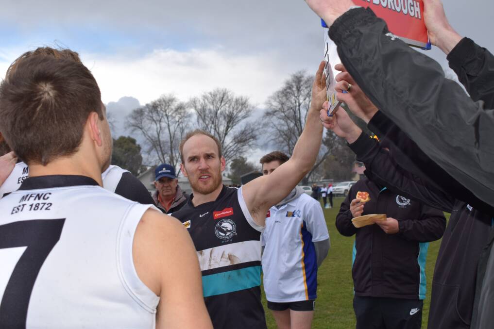 POSITIVE: Maryborough coach Ben Lavars instructs his young playing group at quarter time of Saturday's BFNL contest against the Tigers at Kyneton Showgrounds. Picture: KIERAN ILES