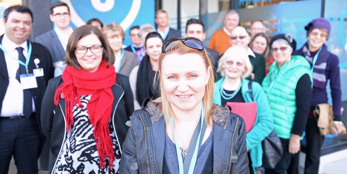 ACTION: Carolyn O'Sullivan (front), whose work on families living with disability inspired the formation of the disability housing group, with members of the group outside Haven; Home Care. Picture: DARREN HOWE
