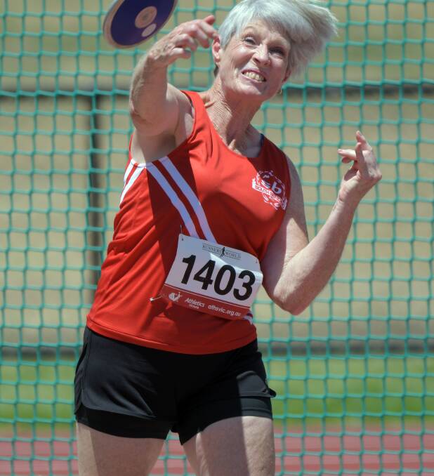 Joan Self, pictured competing in discus, has set new Bendigo Centre records in the 80m hurdles and javelin. Picture: GLENN DANIELS
