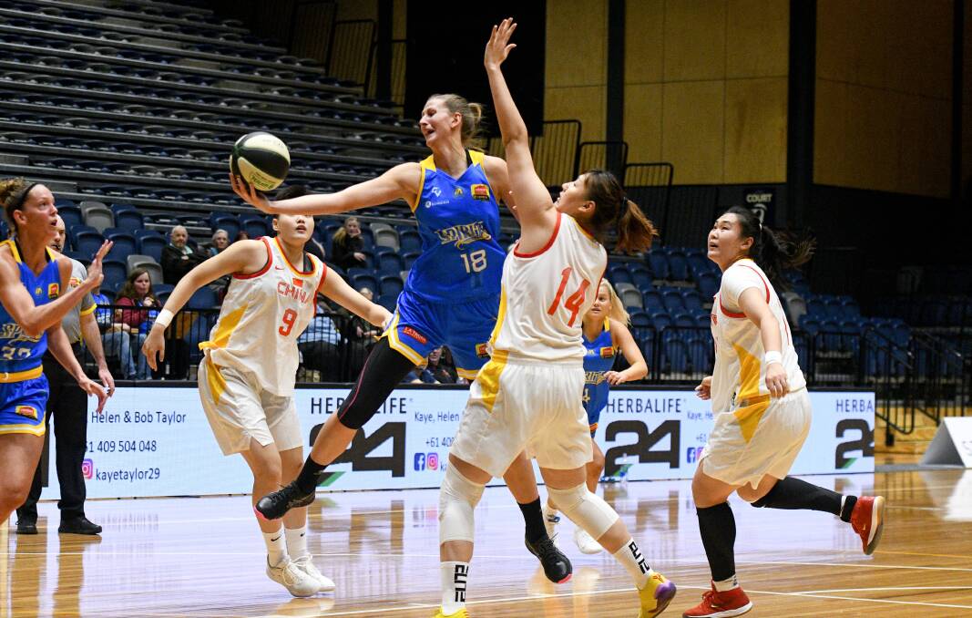 HARD-WORKING: Carley Ernst in action during a pre-season hit-out against a Chinese representative team.