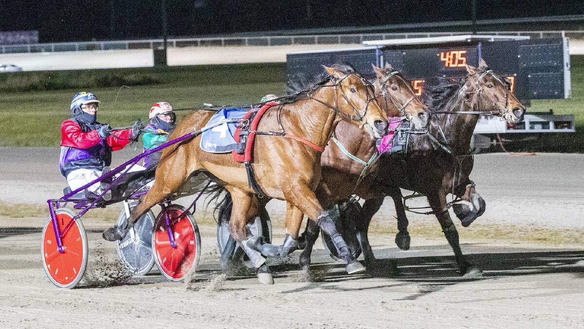 The Penny Drops, on the outside and driven by Grant Campbell, toughs it out to defeat Robbie Royale and Kyvalley Chief in last year's Group 3 Kilmore Trotters Cup. Picture: STUART McCORMICK
