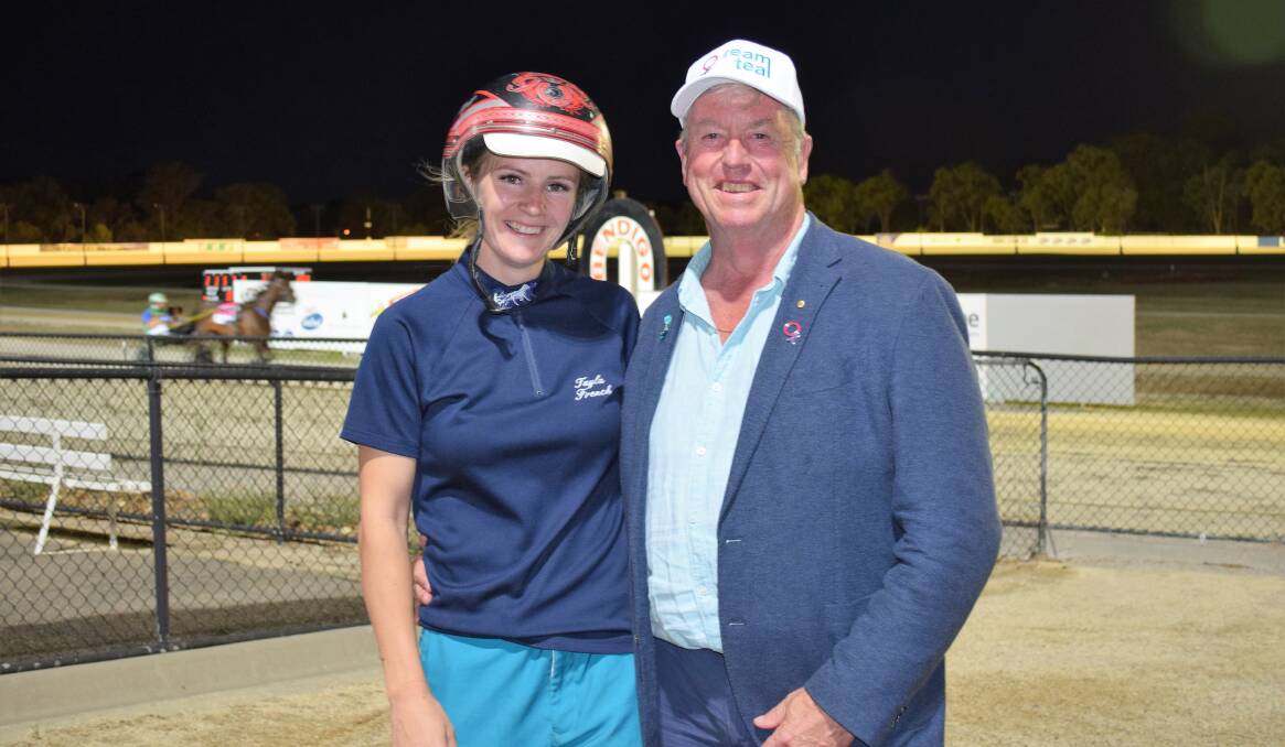 LEADING THE WAY: Tayla French, who leads all Victorian female drivers this month with 10 wins, with Team Teal founder Duncan McPherson OAM at Bendigo's Lord's Raceway last week. Picture: KIERAN ILES