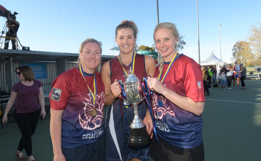 Dual premiership coaches Tamara Gilchrist and Heather Oliver celebrate with defender Carly Van Den Heuvel.