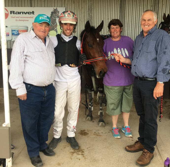 Winning trainer Kylie Linsell, her father Keith, driver Greg Sugars and owner Greg Fleming with Daylight At Dawn at Lord's Raceway on Tuesday night.