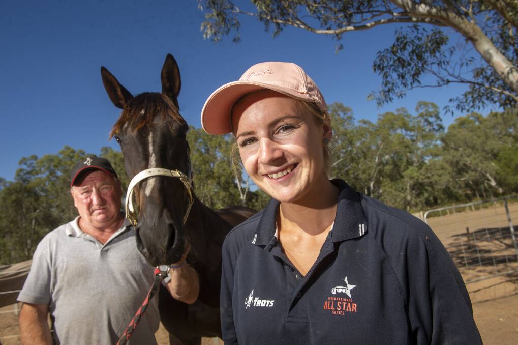 The father-daughter combination of Terry and Tayla French with Bendigo Pacing Cup contender Form Analyst on their Heathcote property. Picture: DARREN HOWE