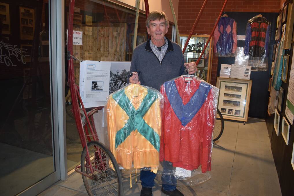 DUAL AWARDS: Noel Ridge with part of the Bendigo Harness Racing Club's history and memorabilia collection at Lord's Raceway. Picture: KIERAN ILES