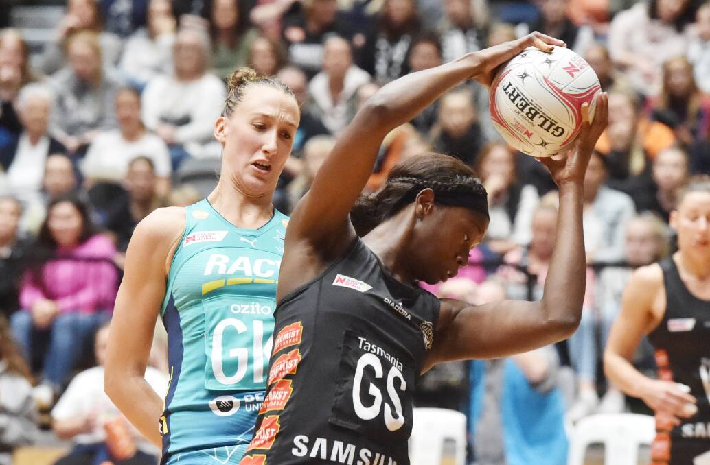 Magpies goal shooter Shimona Nelson clutches the ball ahead of Melbourne Vixens goal keeper Emily Mannix. Picture: DARREN HOWE