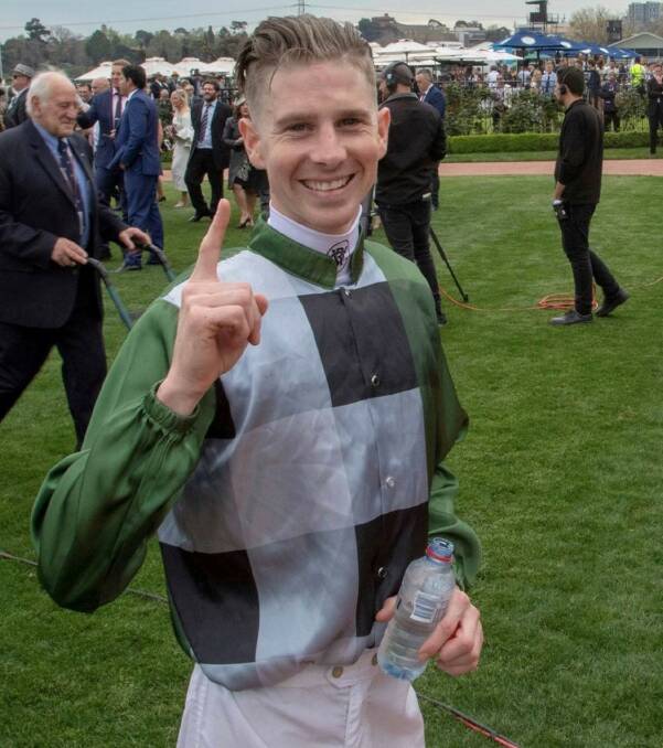 Jye McNeil is all smiles as he celebrates his Group 1 achievement at Flemington. Picture courtesy Racing.com