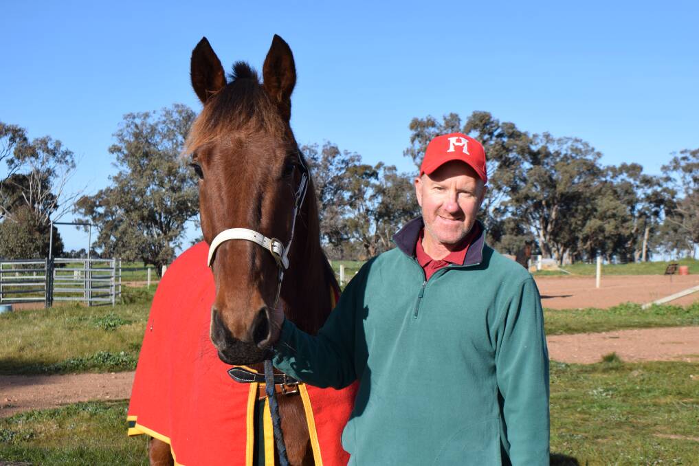 Trainer Graham McDermott on his Myola property with his impressive debut winner Heres To You Jimmy. Picture: KIERAN ILES