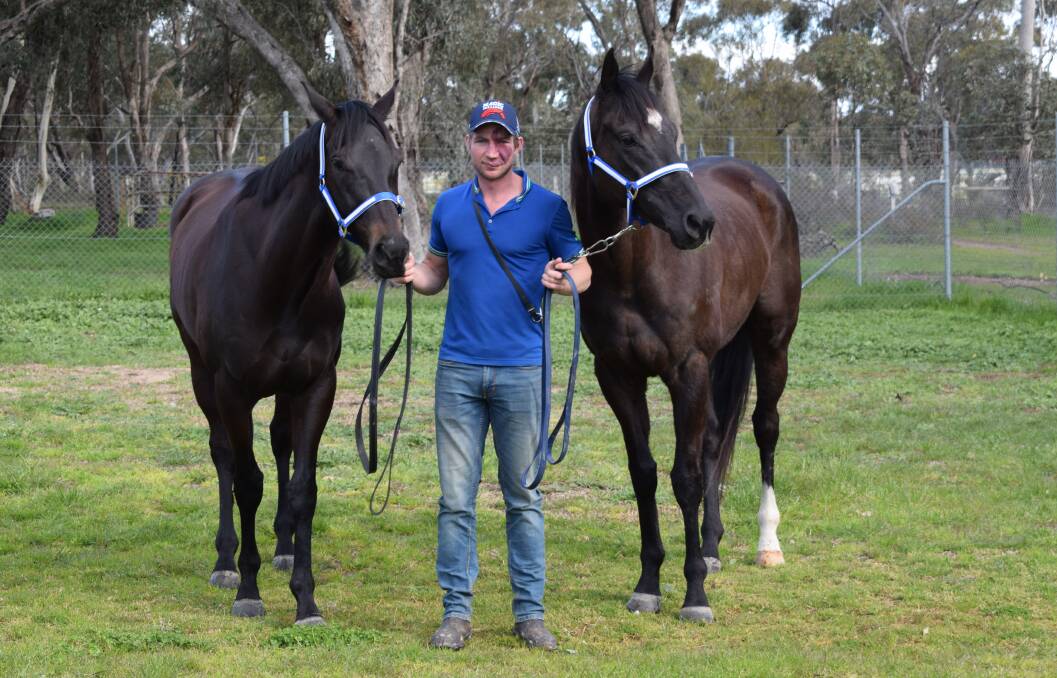 Trainer Nick Smart with two of his stable stars Silent Command, who won at Murray Bridge on Saturday, and Single Handed. Picture: KIERAN ILES