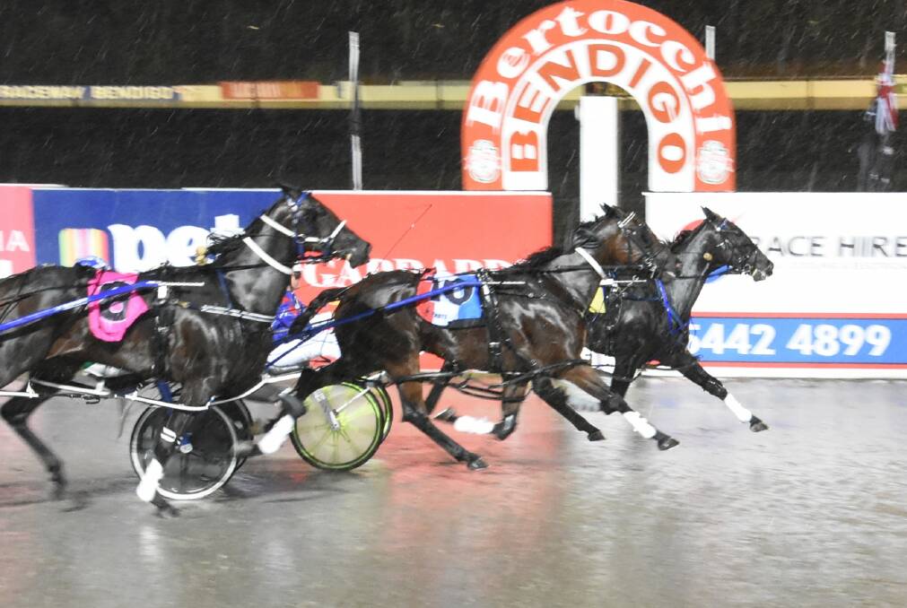 Gobsmacked, with Rod Lakey in the sulky, holds off determined challenges from Brackenreid and Torrid Saint to win at Lord's Raceway on Friday night.Picture: CLAIRE WESTON PHOTOGRAPHY