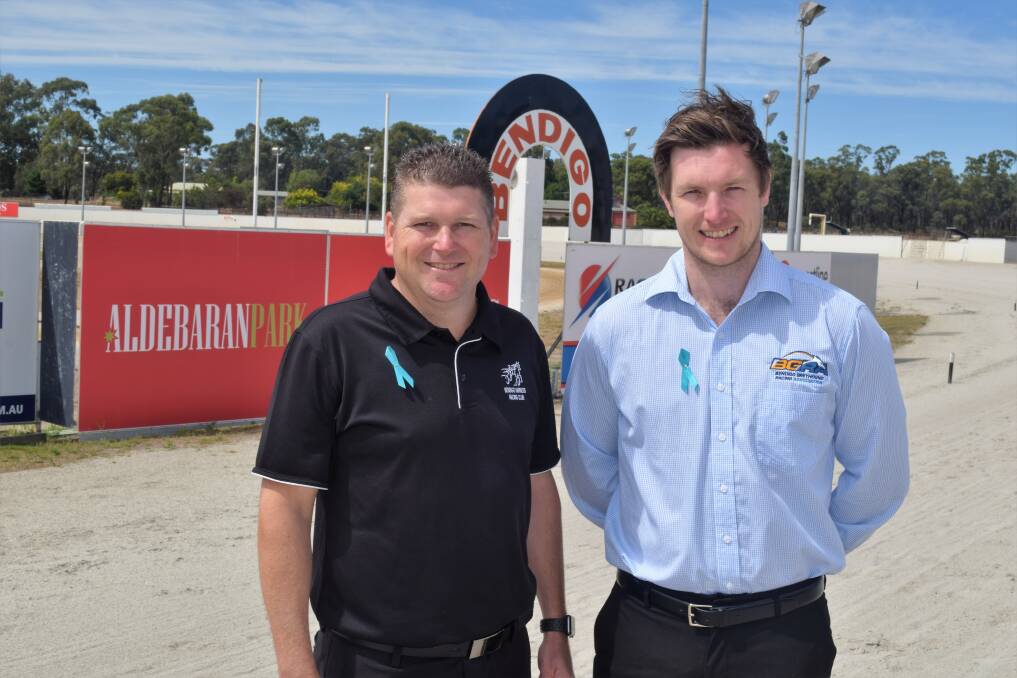 TEAM WORK: Bendigo Harness Racing Club general manager Erik Hendrix (left) and Bendigo Greyhound Racing Association general manager Charlton Hindle are busily planning the two clubs' major Team Teal fundraiser for this year, to be held on February 10. Picture: KIERAN ILES