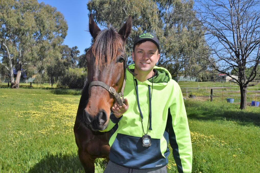 Jayden Brewin with stable favourite Crossroader on the family's Junortoun property. The 21-year-old will drive Sundons Courage in Saturday night's Group 1 Bill Collins Trotters sprint. Picture: KIERAN ILES