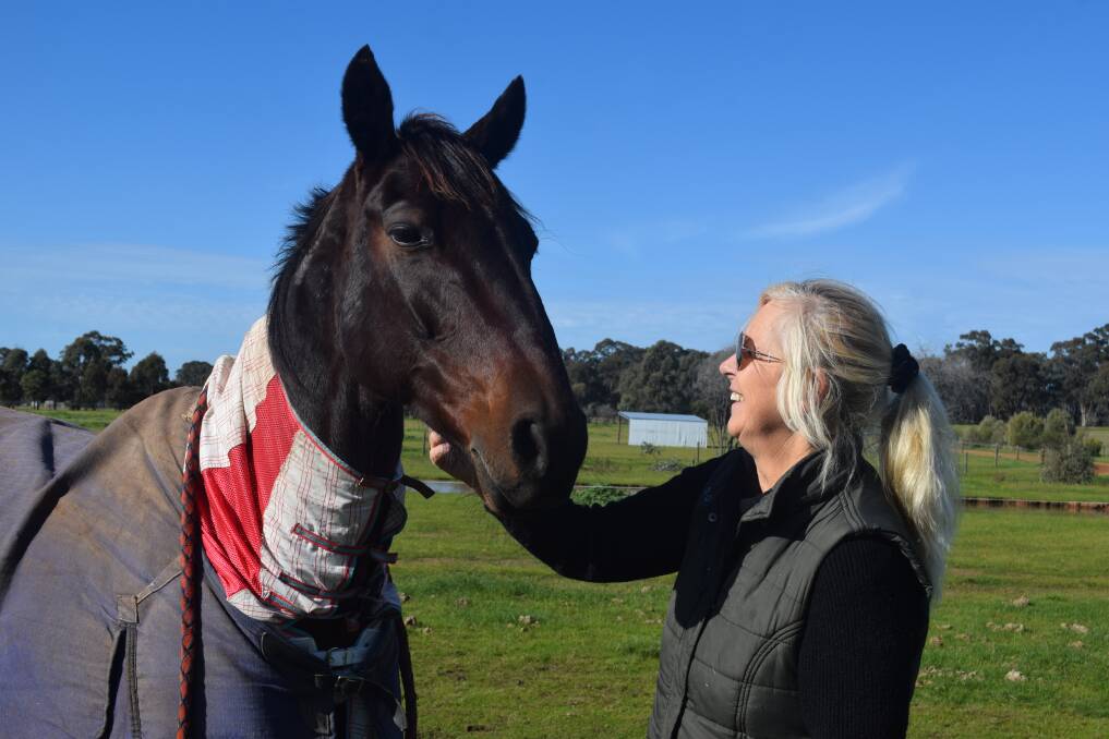 Gabrielle Symons with Friends on the trainer's Sebastian property. Picture: KIERAN ILES