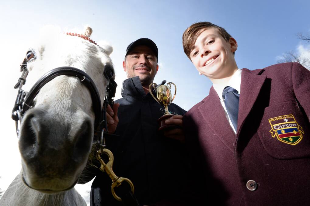 Jett Stanley, is following in the footsteps of his father, Brent Stanley, the 1996 Caulfield Cup winner. He bought his pony, Dad and a Caulfield Cup trophy to school in July last year. Picture: DARREN HOWE