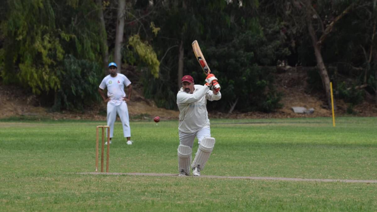 Rob Fisher hits a four during the match against the Peru ROW XI.