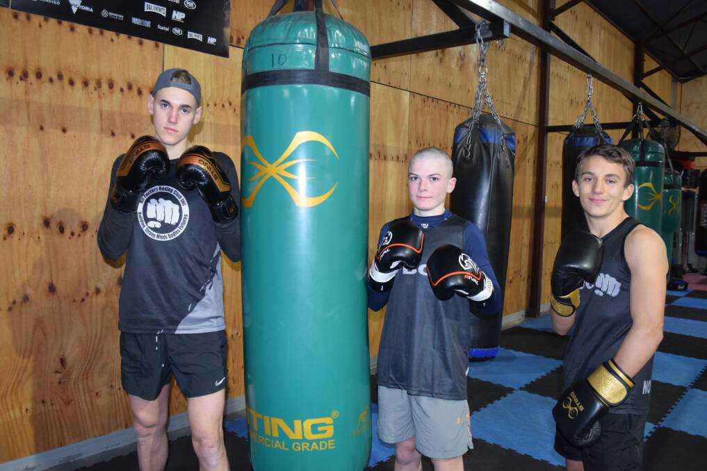 FOCUSED: Sebastian Collins, Sam Kay and Harry Jackman at the Hit Factory boxing gym in Golden Square. Picture: KIERAN ILES